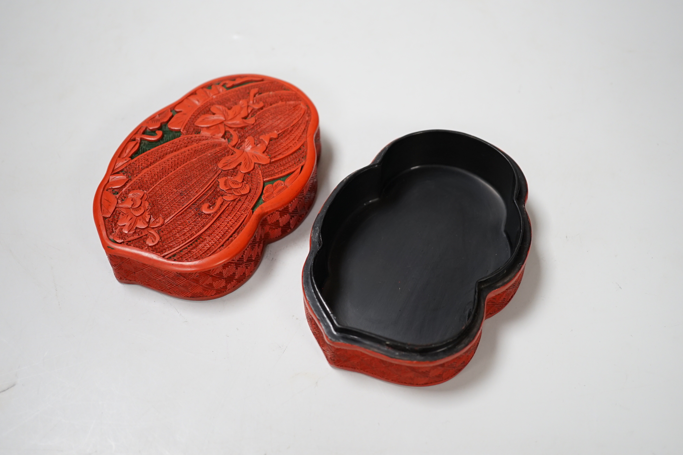 A Chinese cinnabar lacquer box and cover, decorated with bitter melons, 12cm high